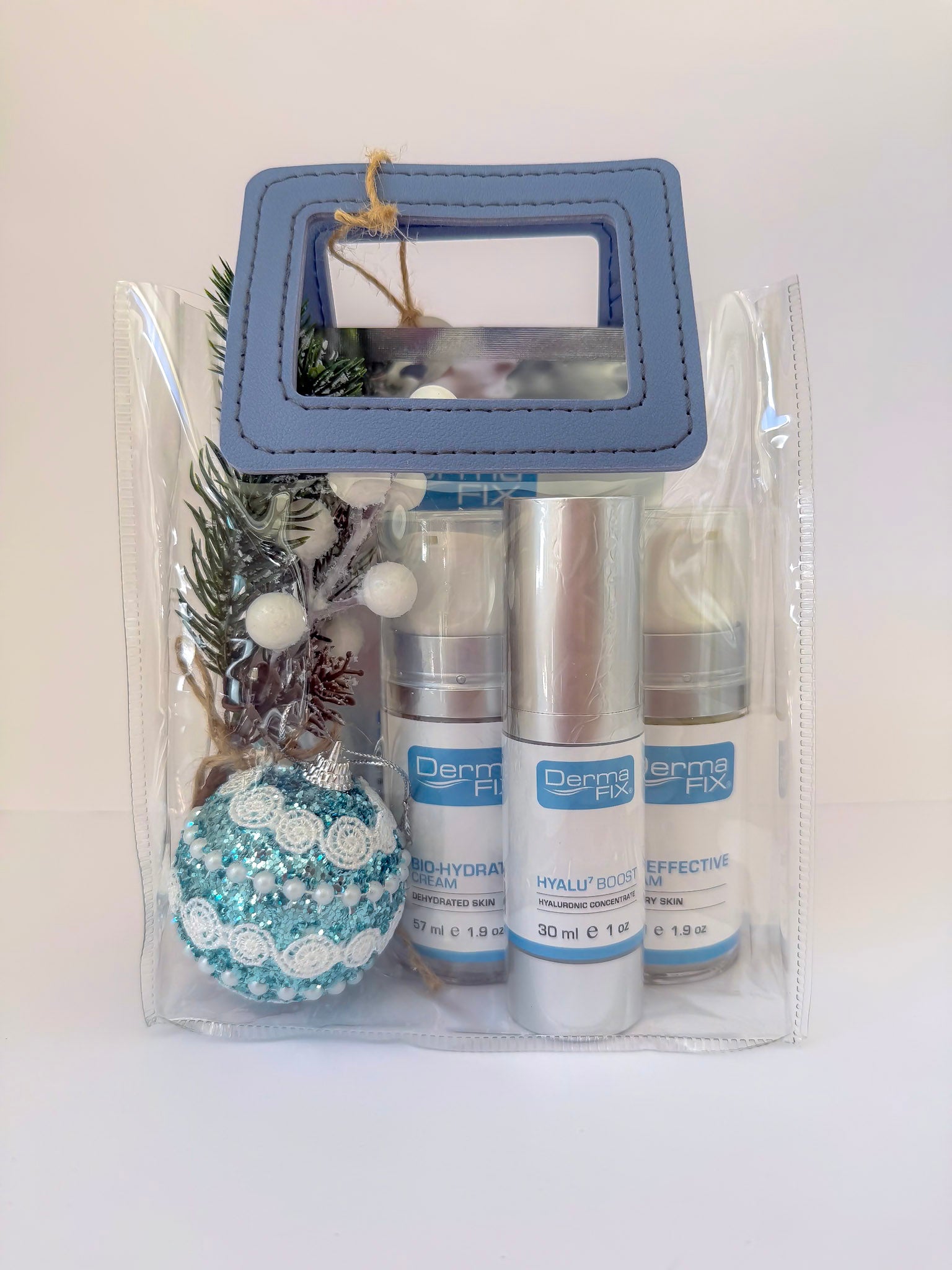 Packaged skincare products with decorative items on a white background