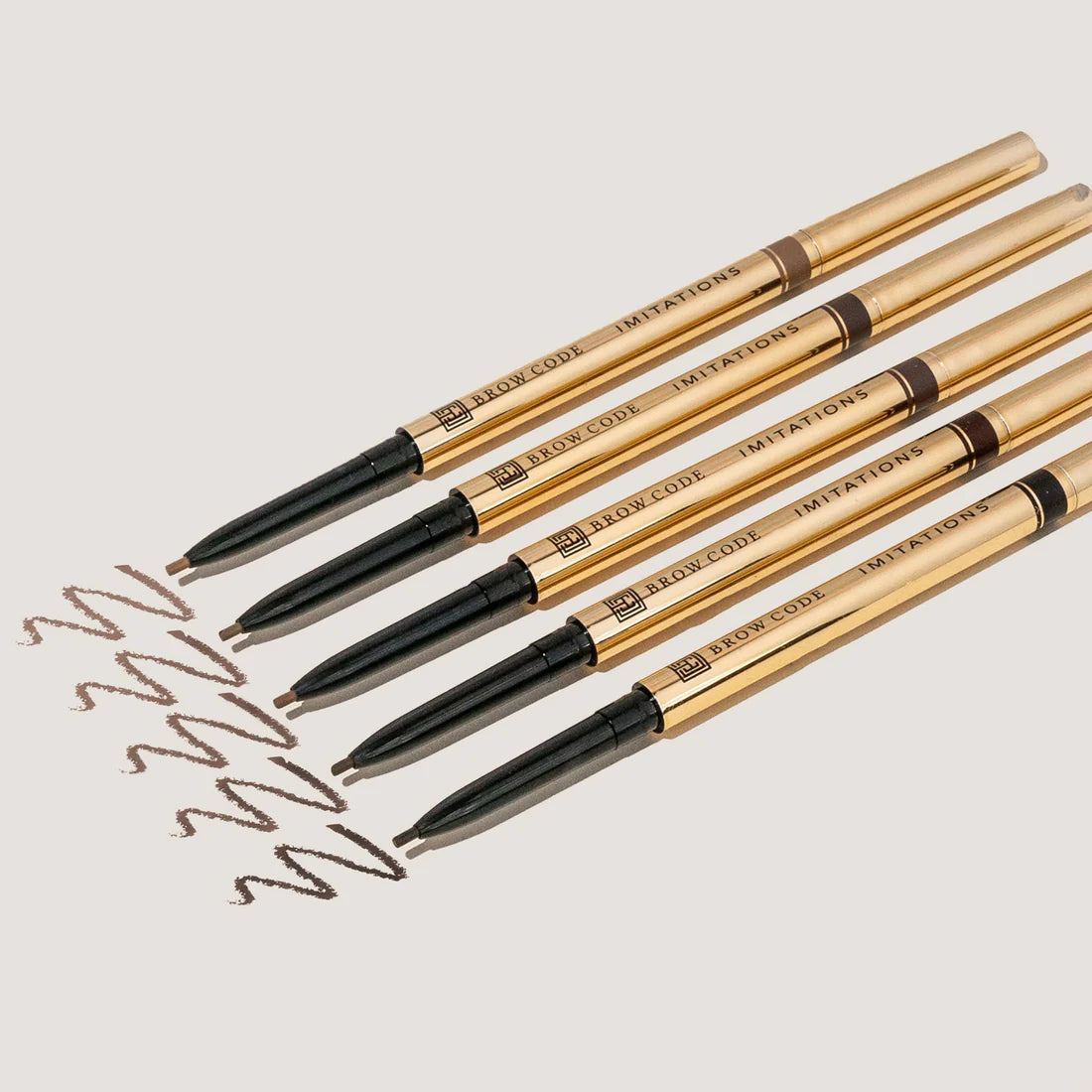 Five Brow Pencils showing different shades with swatch lines.