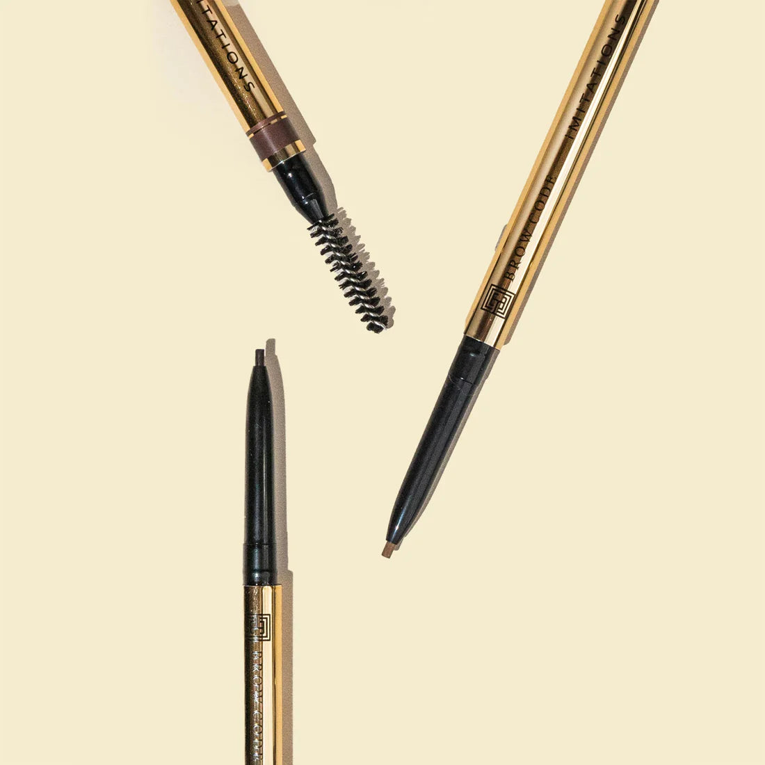 Brow Pencil showing fine tip and built-in spoolie brush.