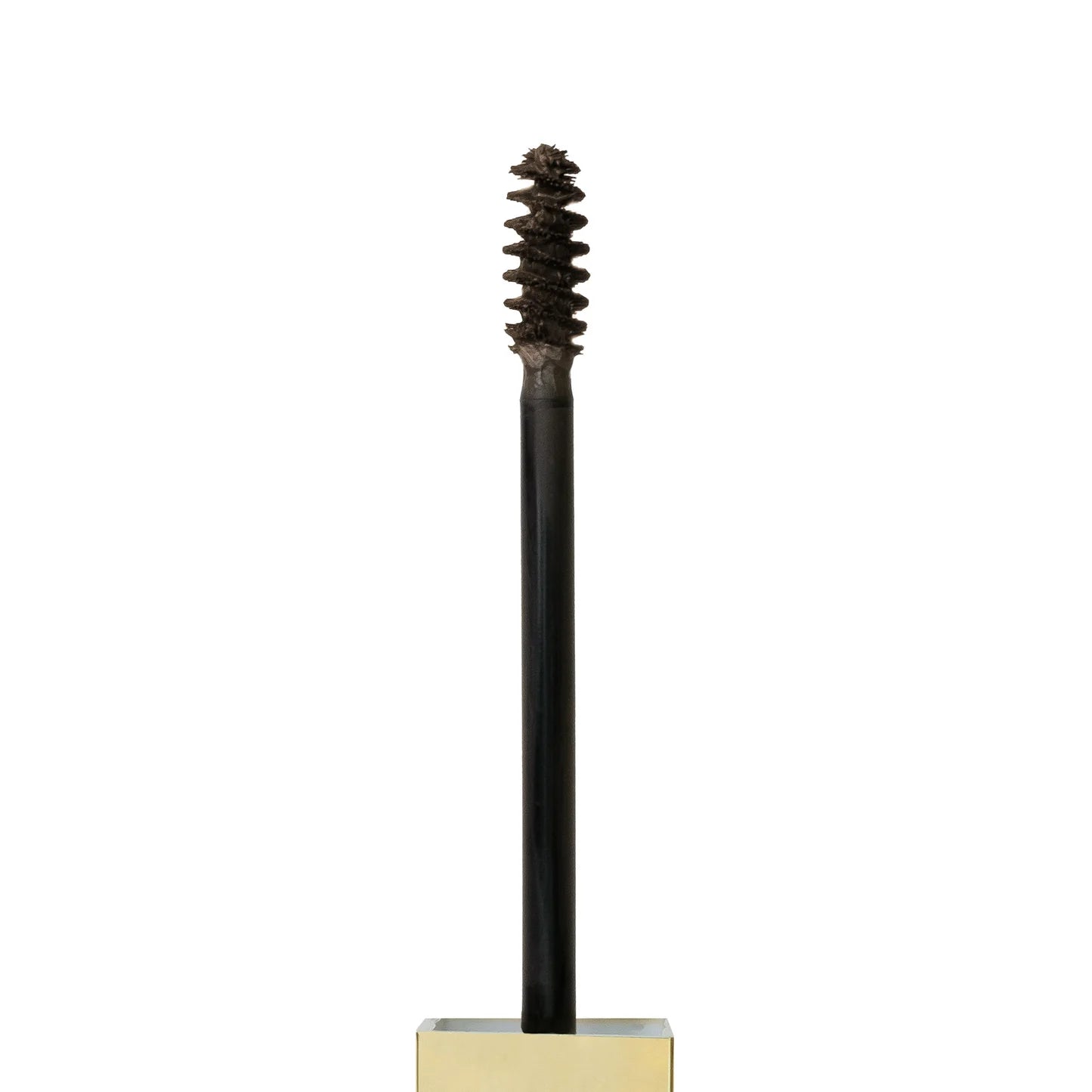 Close-up of precision applicator brush for even brow application