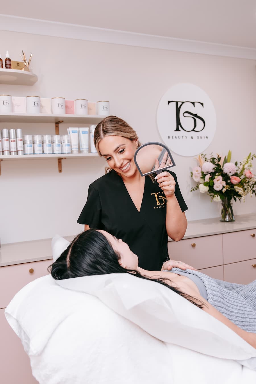 Jess Dash consulting with client after brow lamination at TGS Beauty & Skin salon in Perth