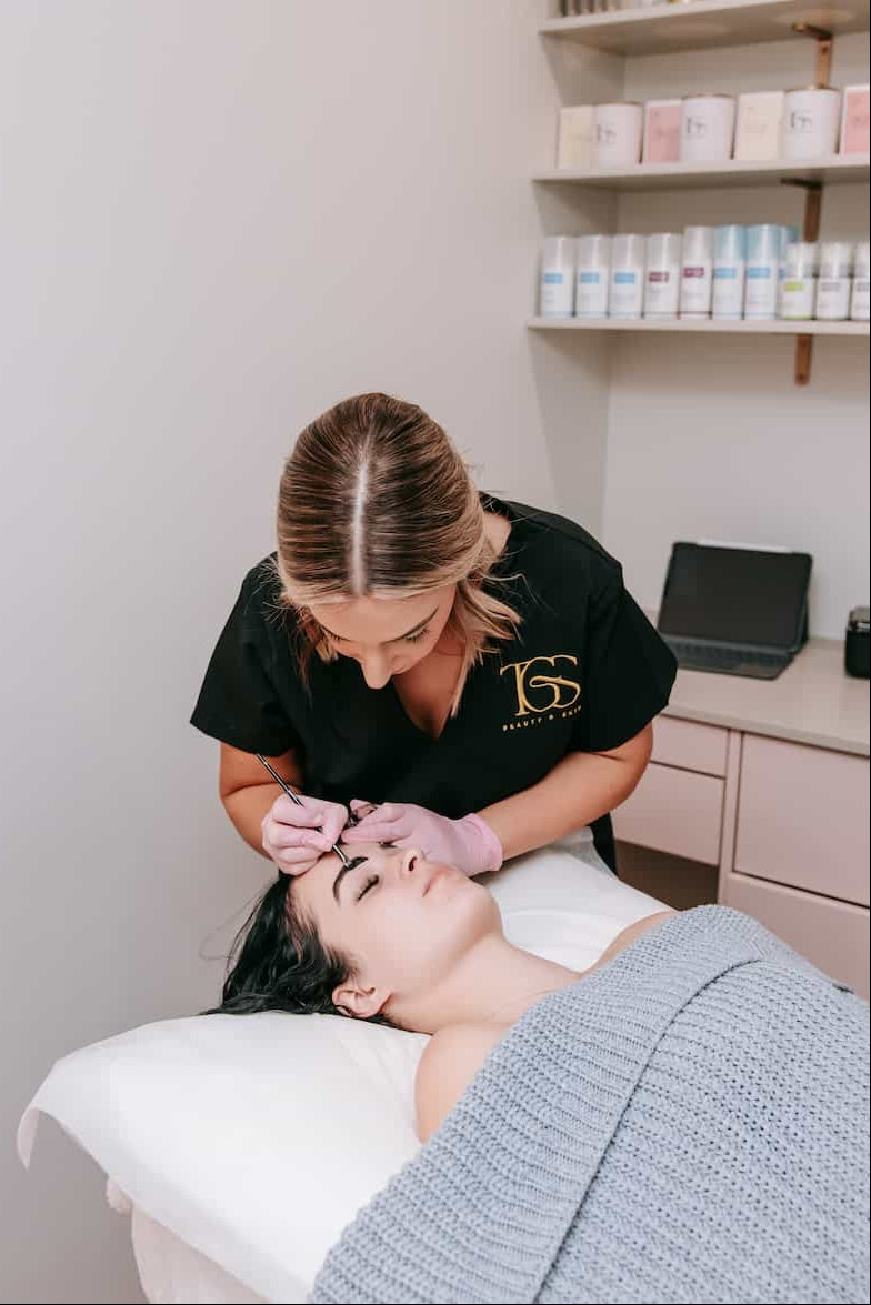 Brow tint service in progress by TGS Beauty therapist at Hammond Park clinic