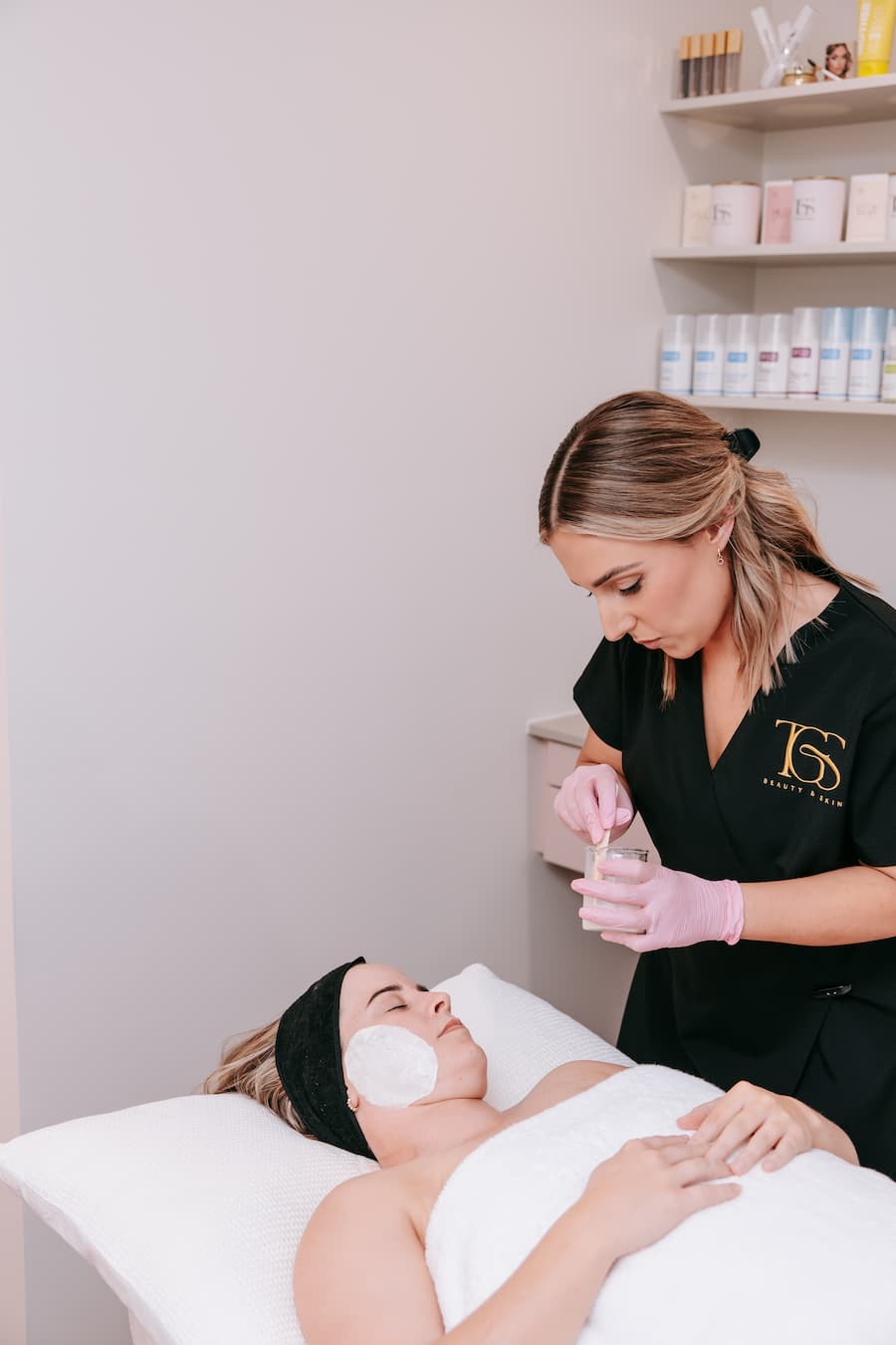 TGS Beauty therapist performing DermaFix Alkaline Wash treatment for skin revision in Hammond Park