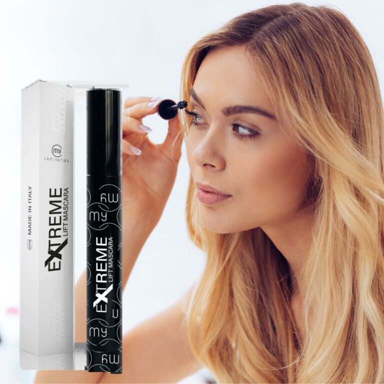 Woman applying mascara to her lashes, demonstrating product use.