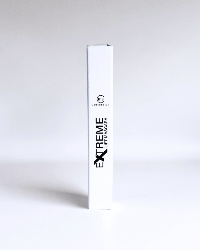 White packaging box of mascara standing upright, clearly showing product branding.