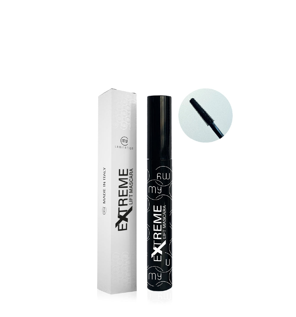 Close-up of mascara tube with applicator brush visible.