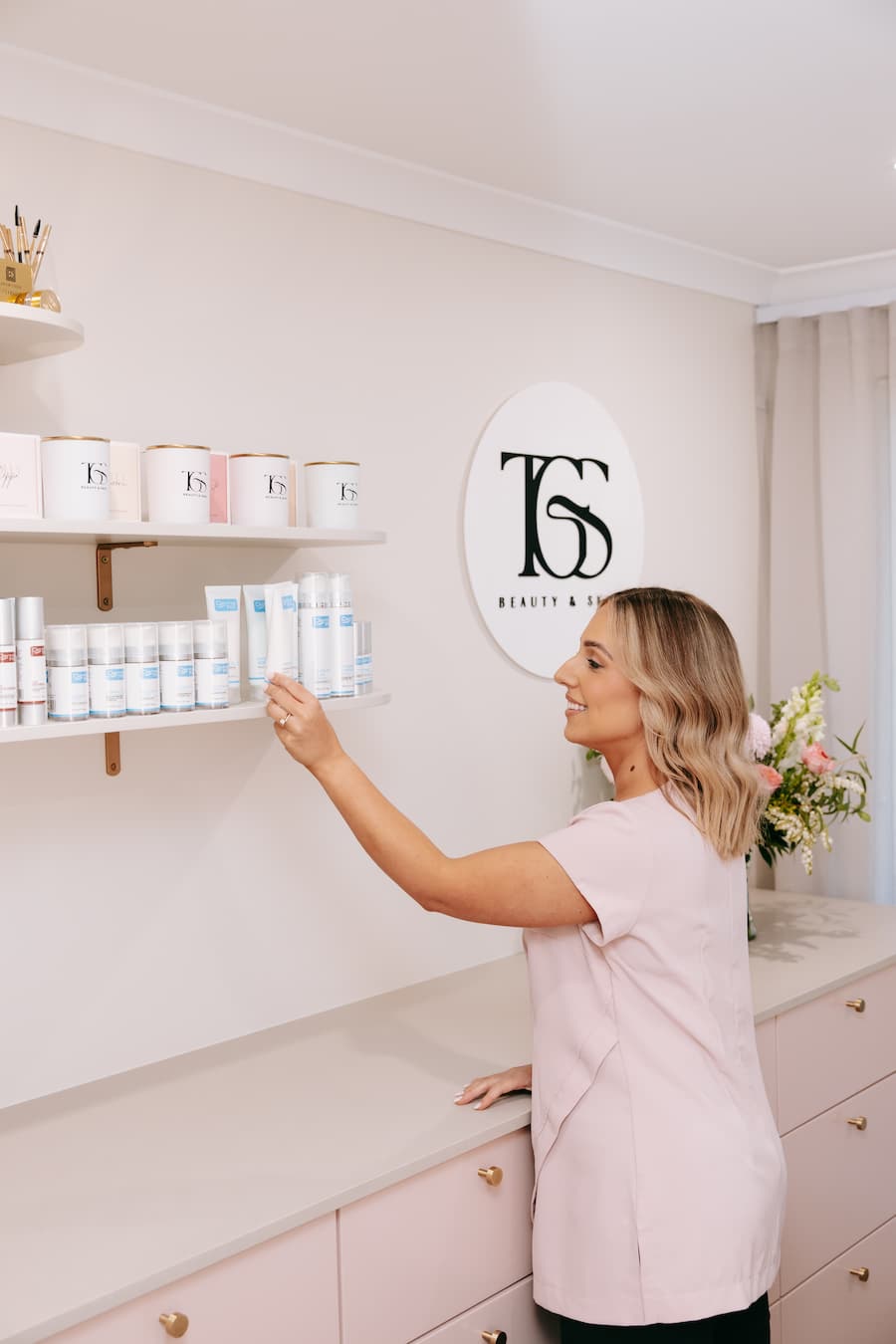 TGS Beauty & Skin salon layout in Hammond Park with DermaFix skincare and handmade candles on display