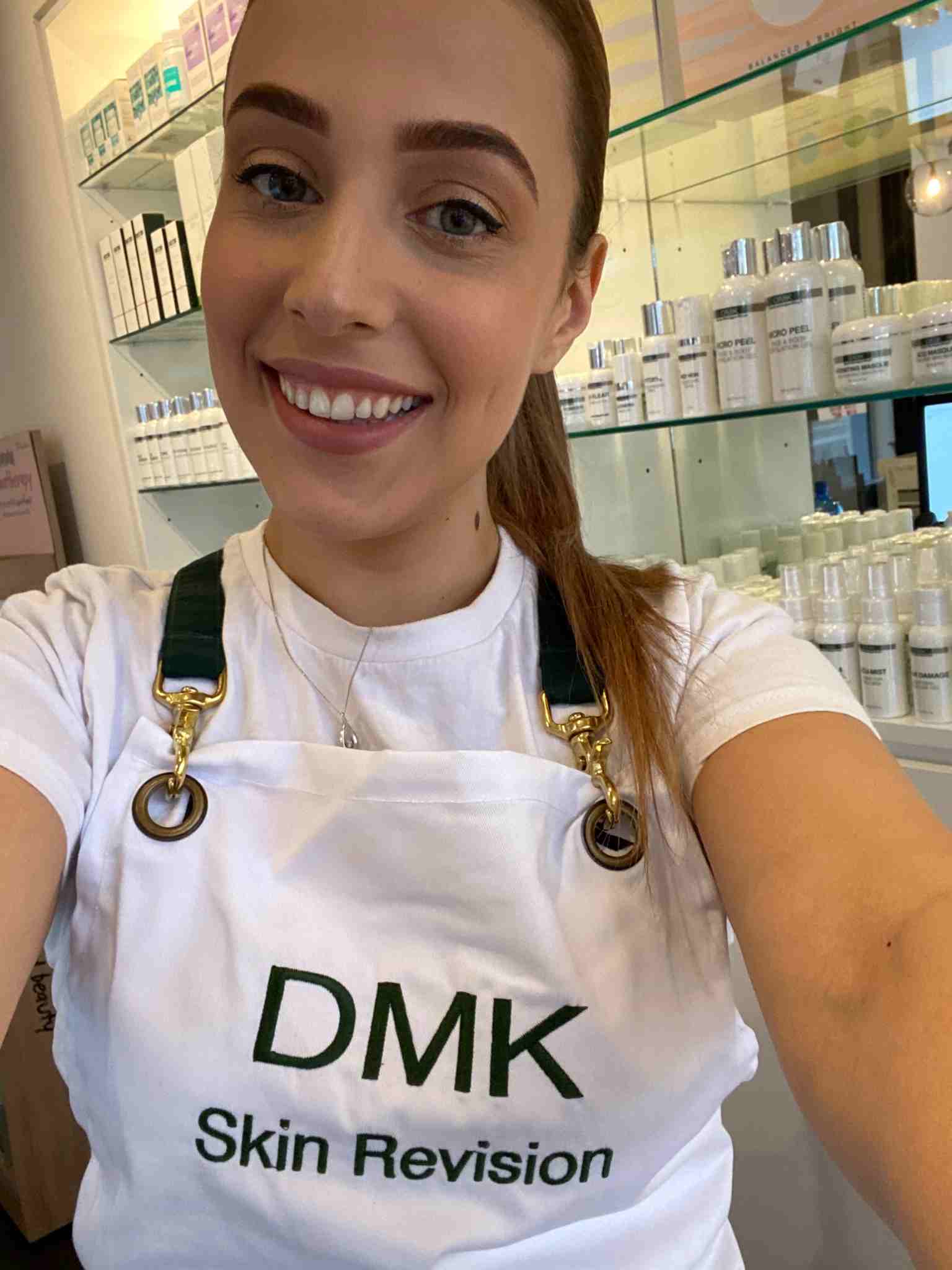 Jess from TGS Beauty & Skin smiling in DMK Skin Revision apron