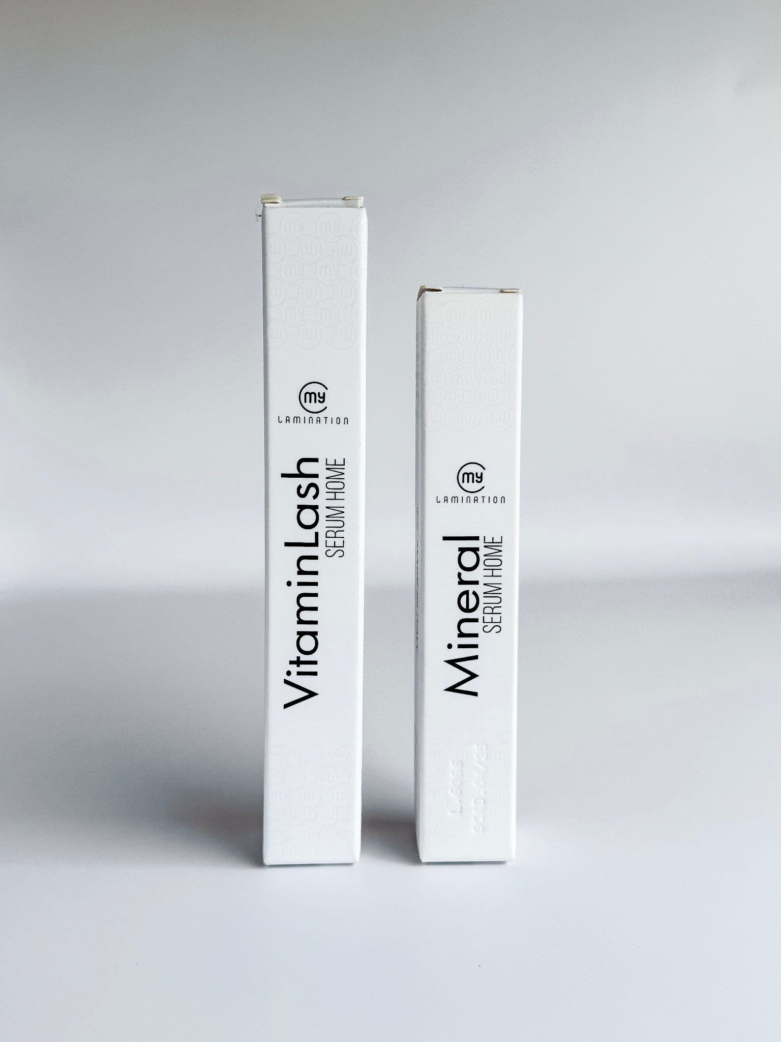 Close-up of two Vitamin Lash Serum boxes by My Lamination