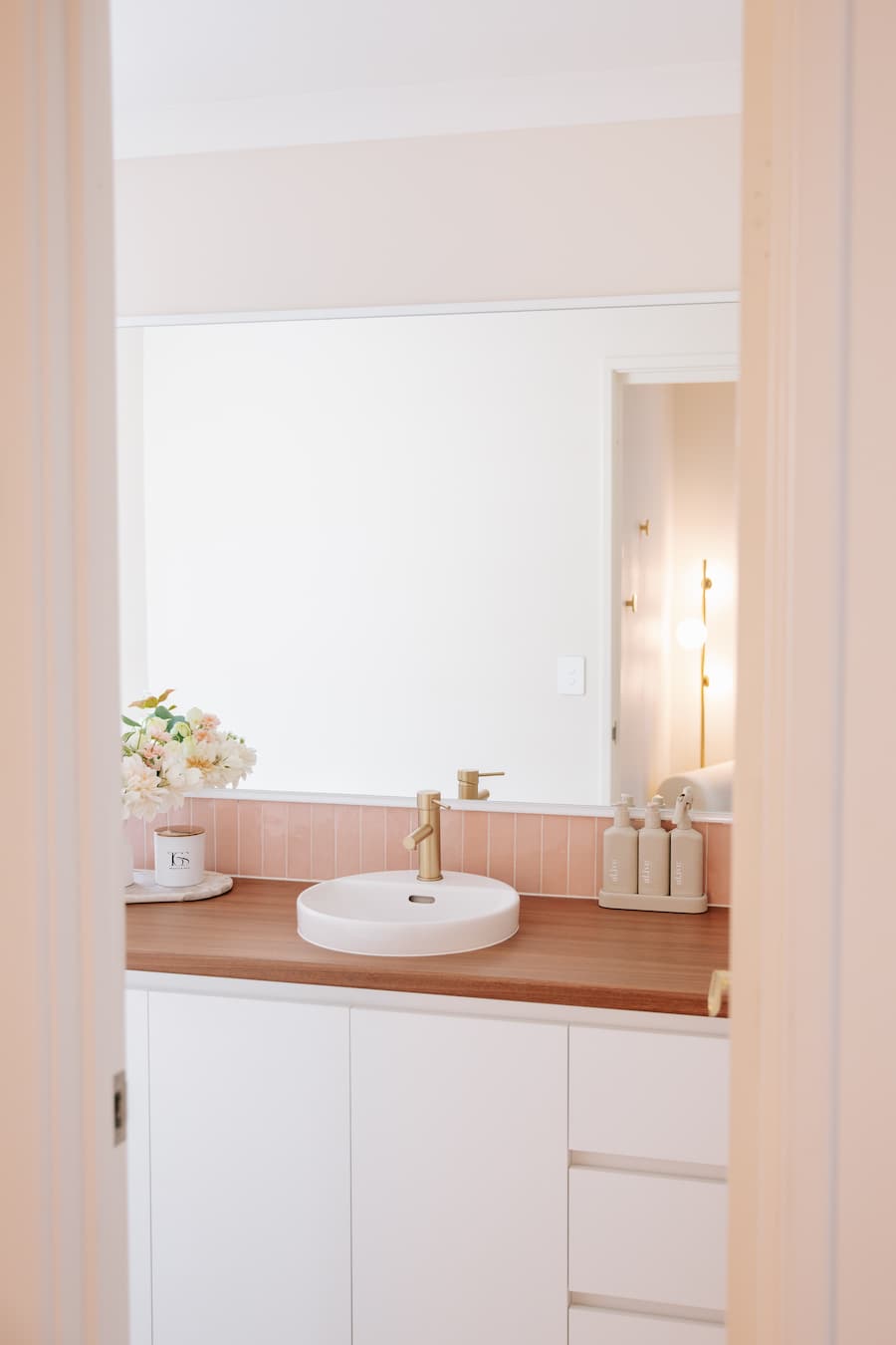 Clean and aesthetic vanity space at TGS Beauty & Skin salon in Perth with handmade soy candle decor