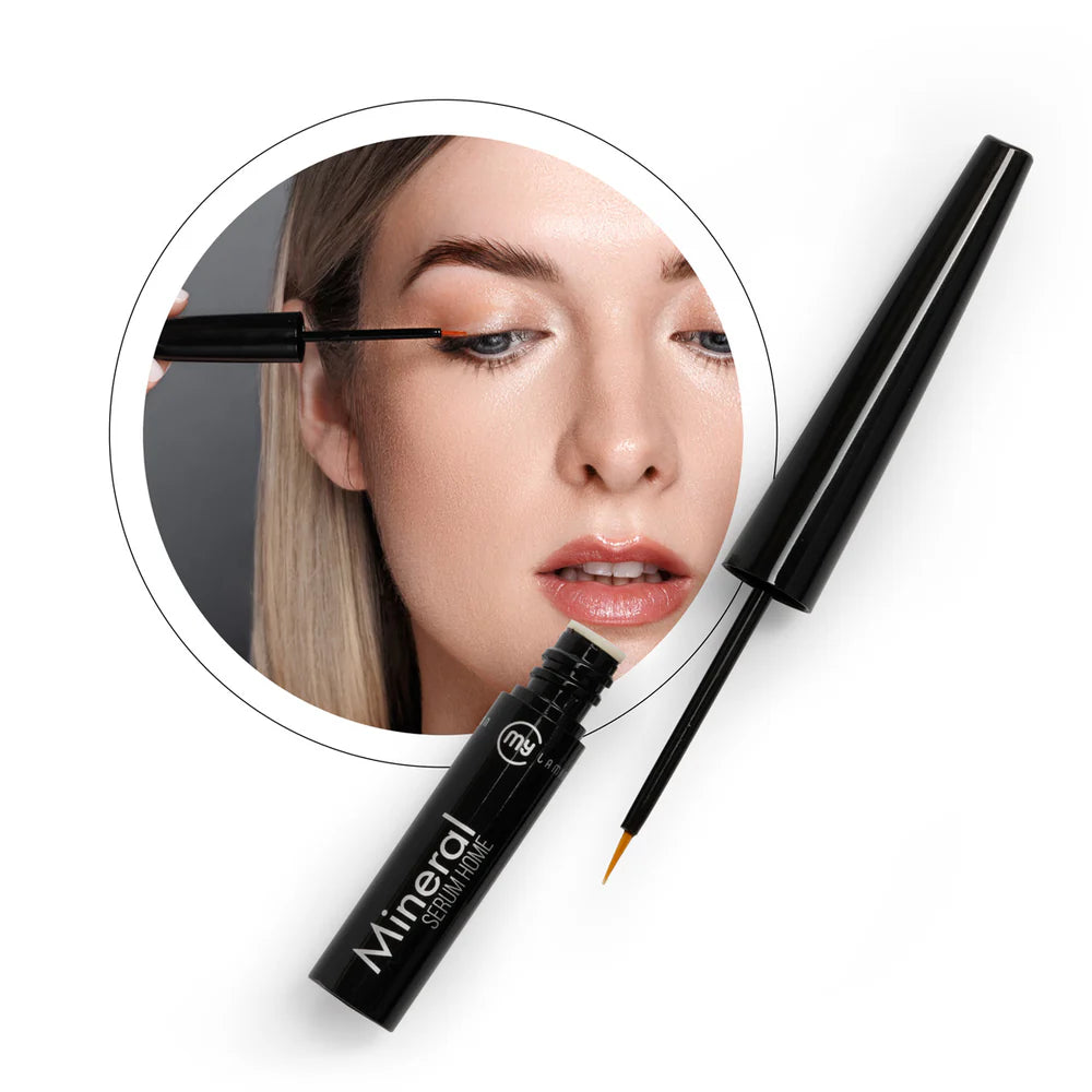 Model applying serum product gently to lashes.