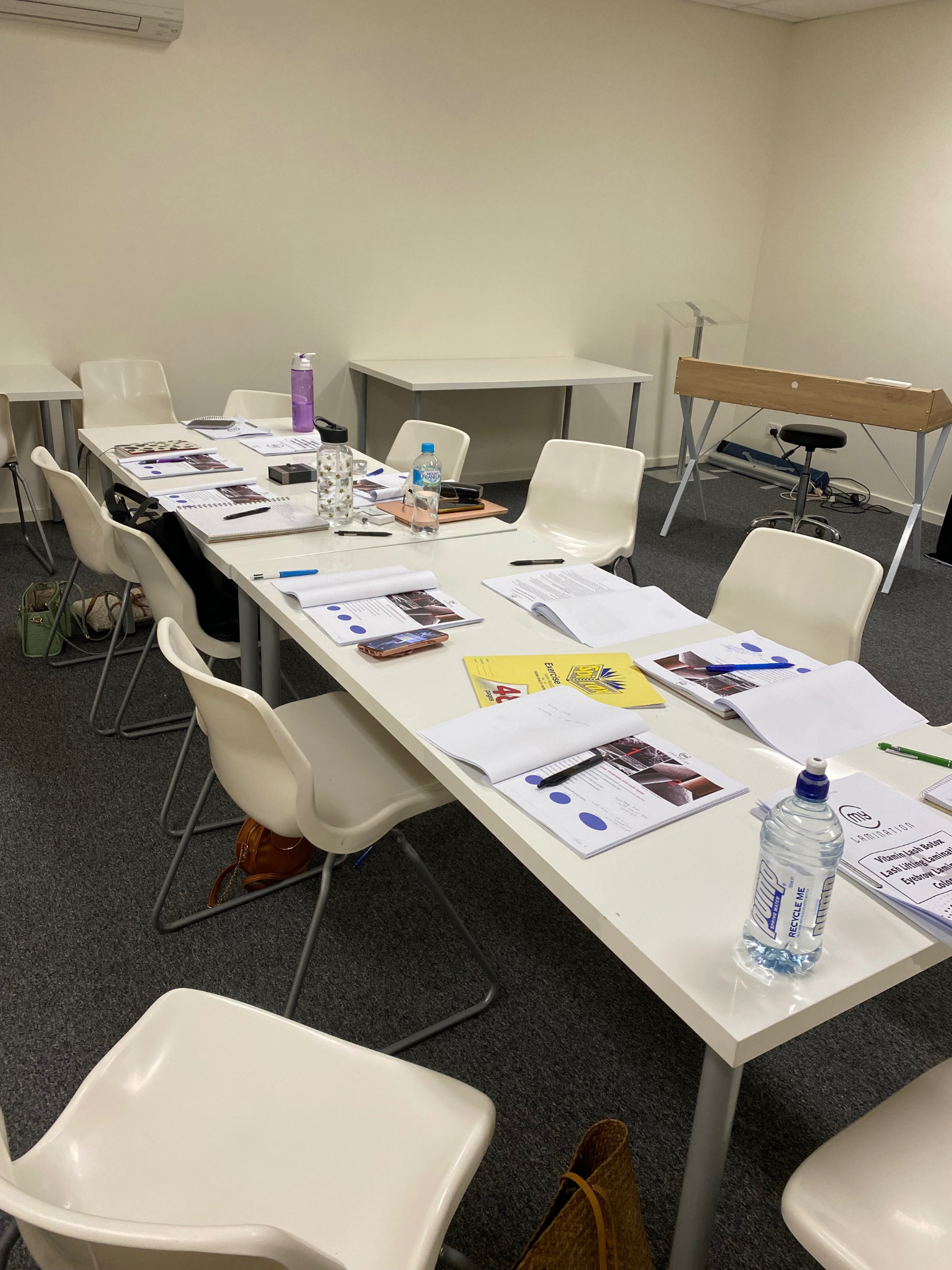 Beauty therapy training classroom setup with course materials and chairs from TGS Beauty & Skin in Perth
