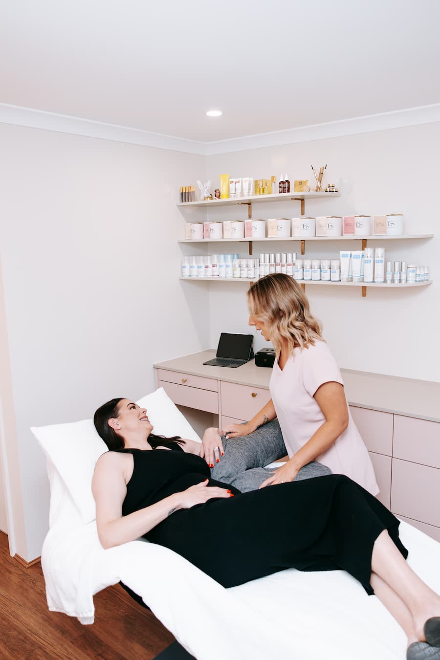 TGS Beauty therapist consulting with client before Pregnancy Glow facial treatment in Hammond Park salon