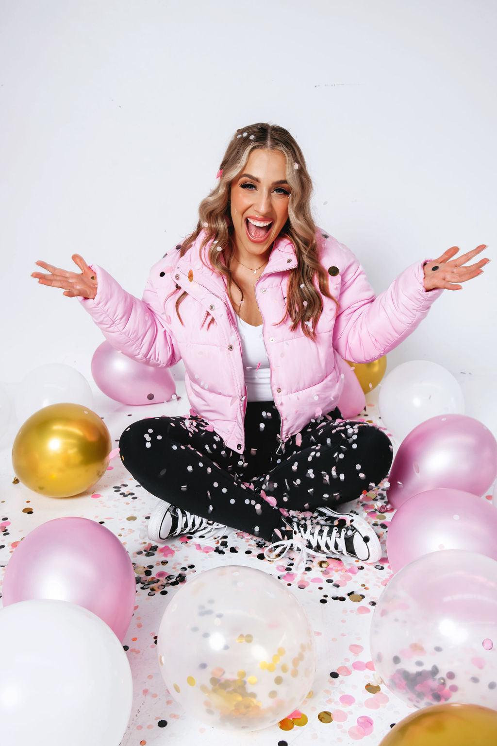 Jess from TGS Beauty & Skin celebrating with balloons and confetti – Perth beauty salon owner