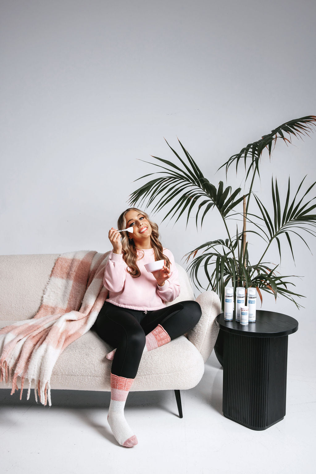 Jess from TGS Beauty & Skin relaxing with skincare products – Perth beauty salon and skincare expert