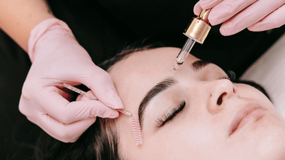 Brow Specialist Applying Brow Gold Oil to Client’s Brows – Professional Brow Aftercare