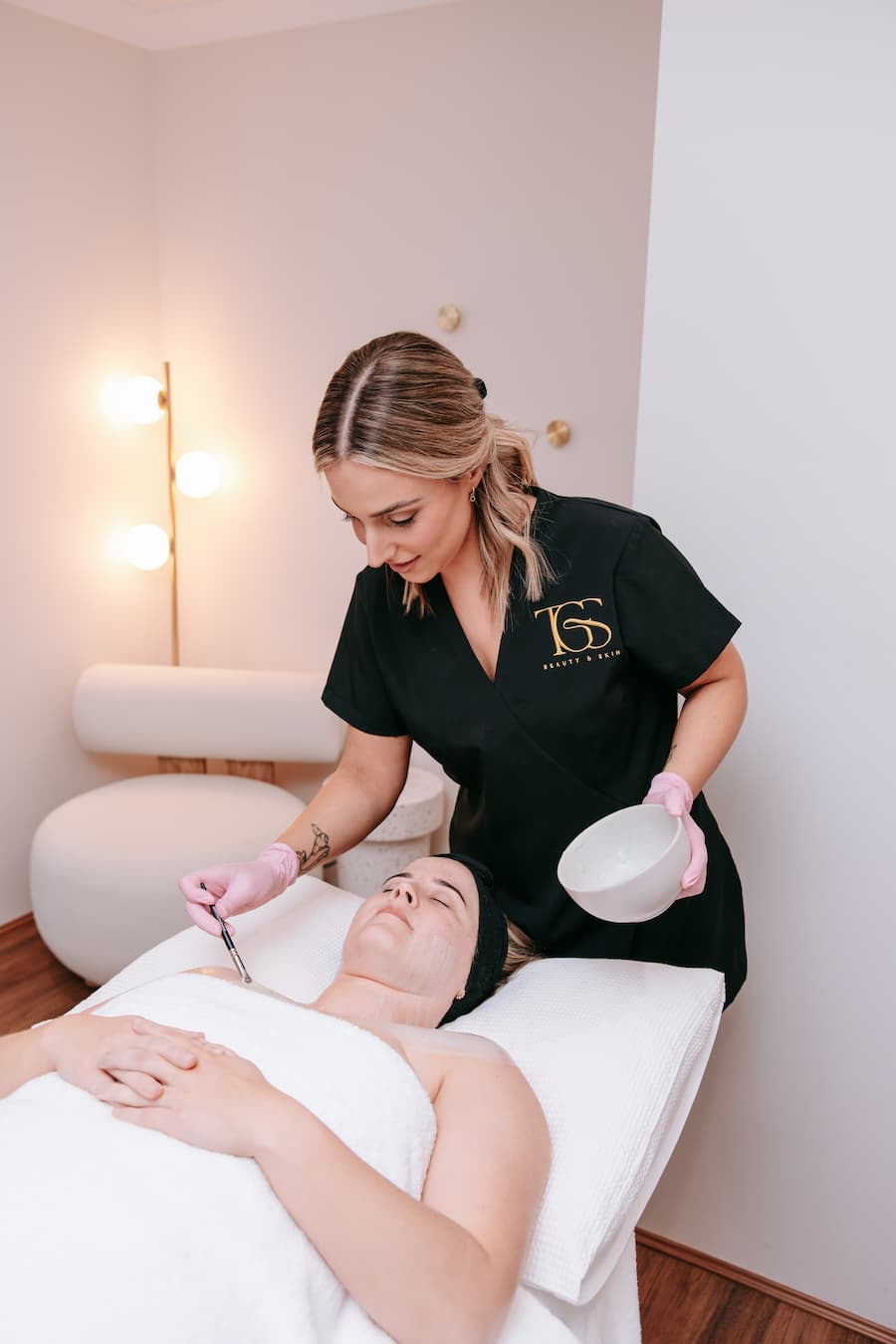 TGS therapist applying DermaFix enzyme mask during skin treatment bundle in Perth clinic